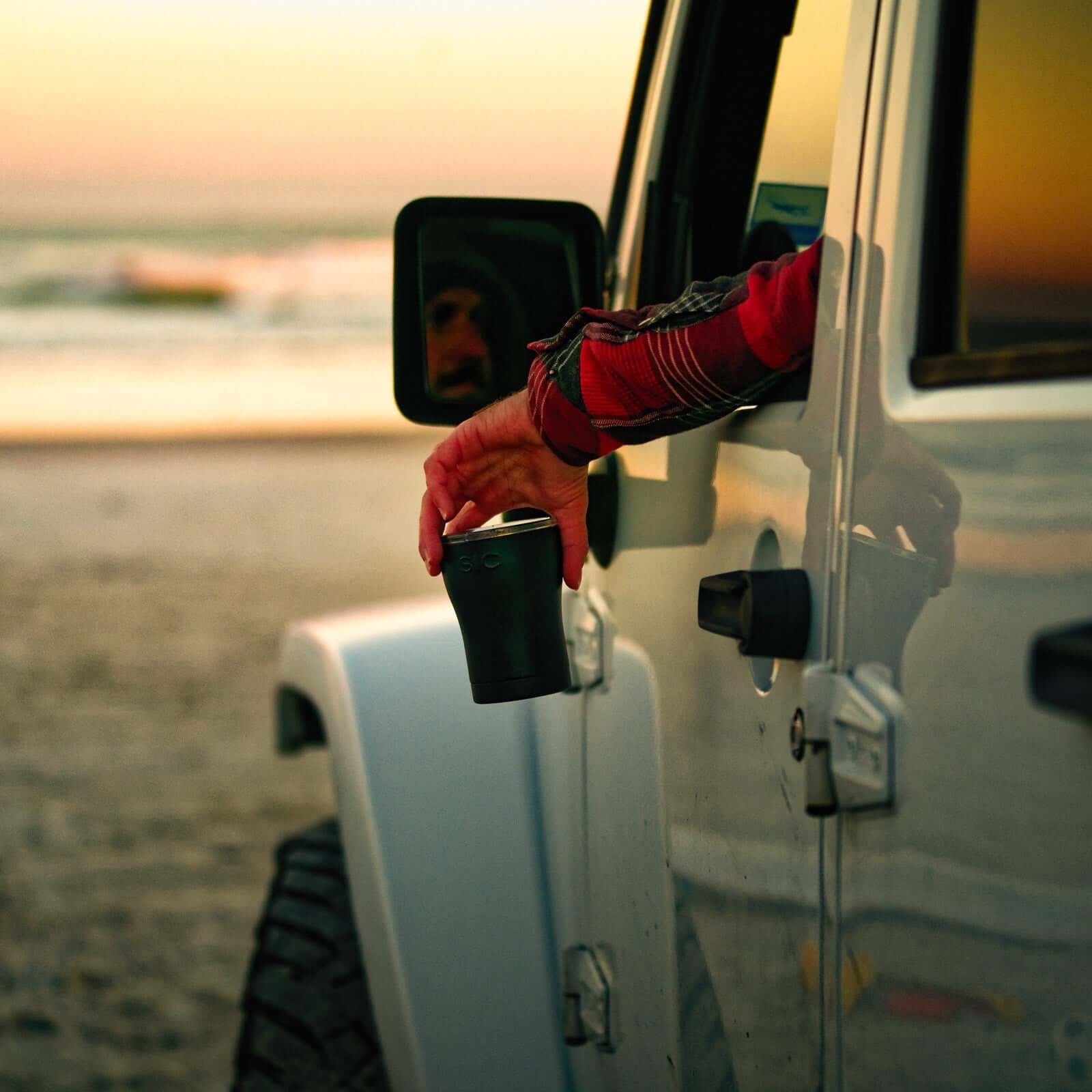 Man in Jeep with Matte Black SIC Cup